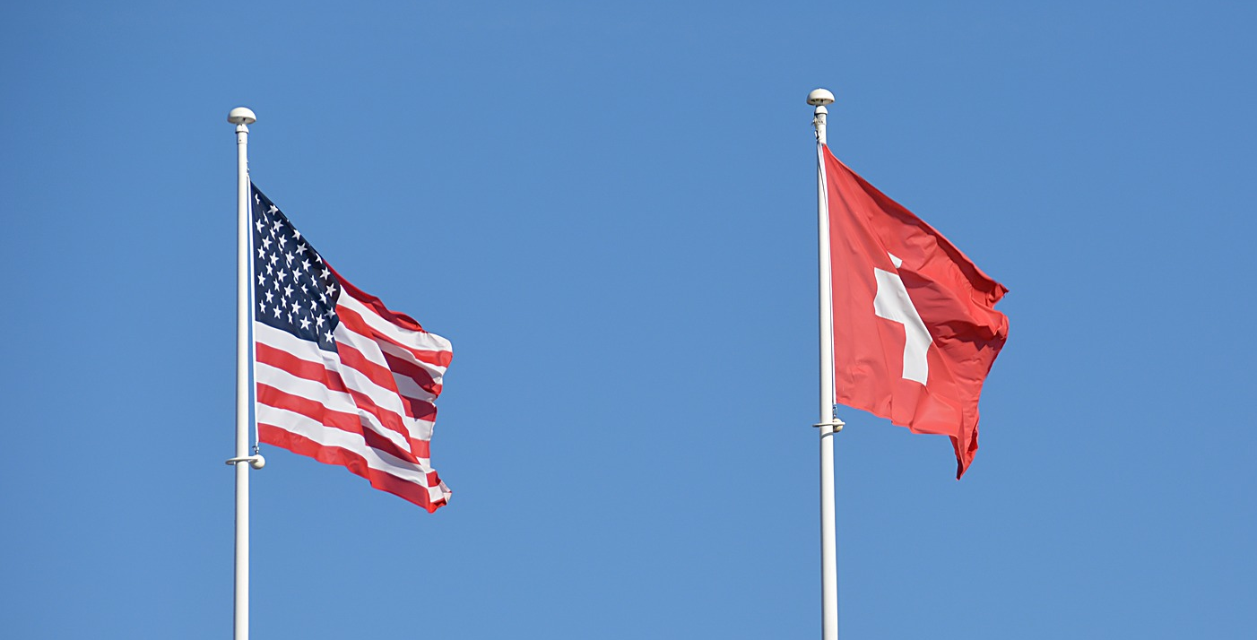 US and Swiss flag US and Swiss flag